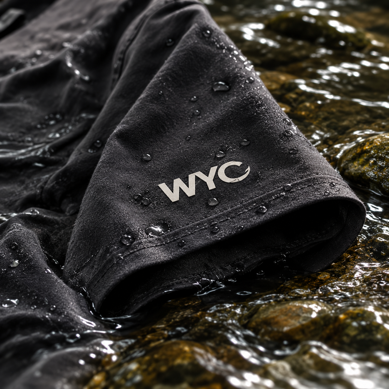 Close view of a WearYourCatch sleeve mark beside the water
